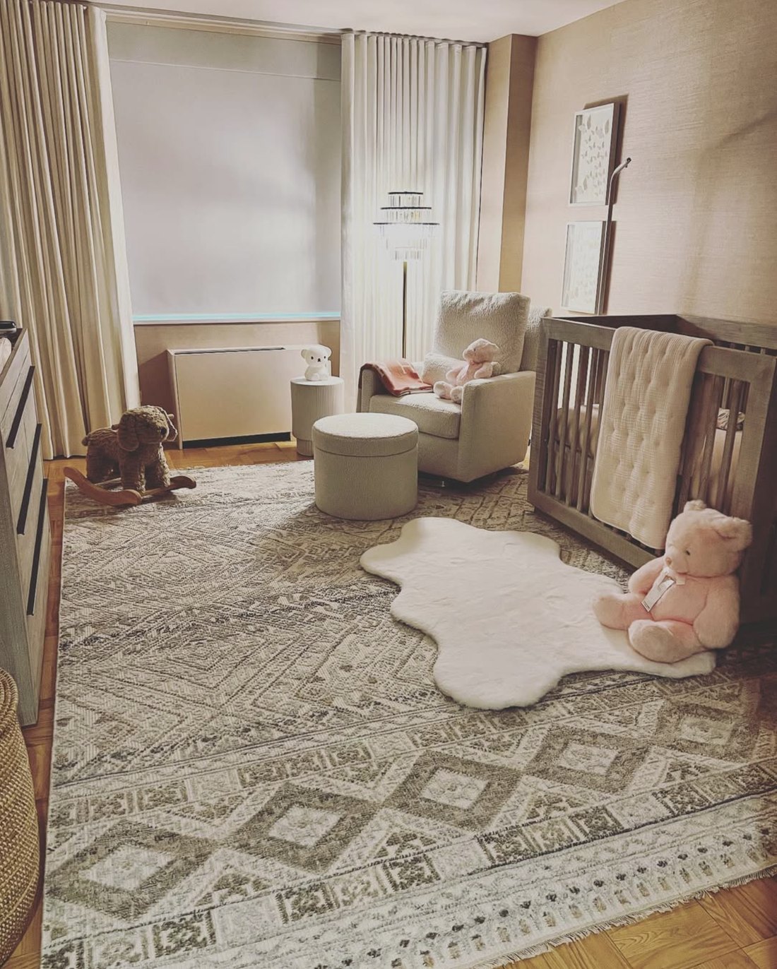 Nursery with patterned area rug