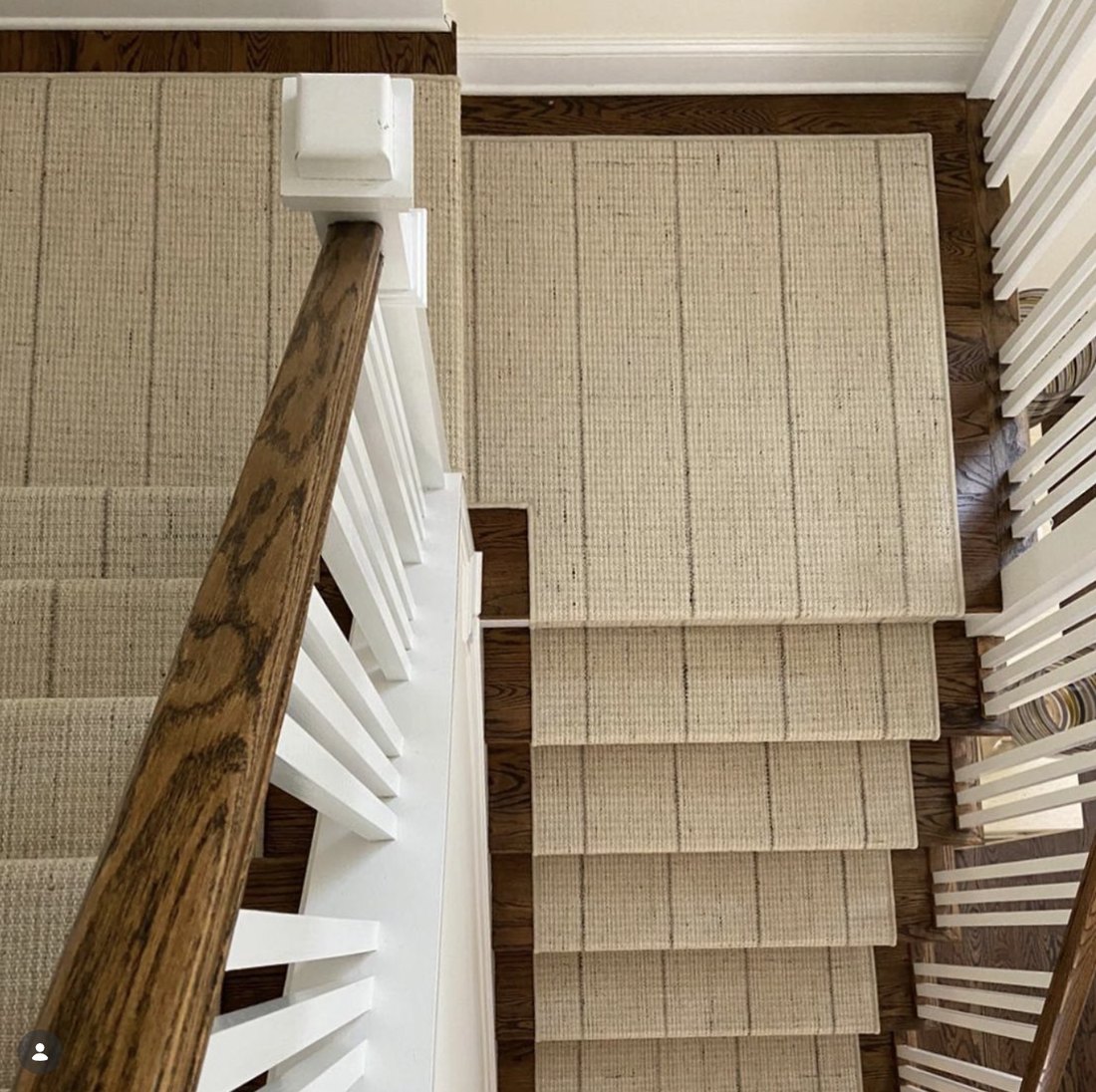 White staircase with natural sisal runner